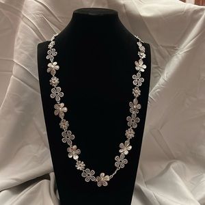 Silver flower necklace.